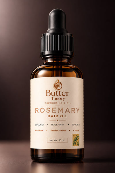 A 30 mL amber glass dropper bottle of Butter Theory Rosemary Hair Oil, featuring a cream-colored label with brown text and a black dropper cap, set against a dark brown gradient background.